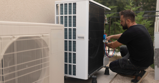 HVAC guy working with a heat pump