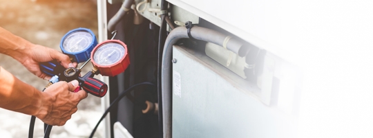 HVAC tech testing freon levels
