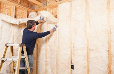 Man installing insulation